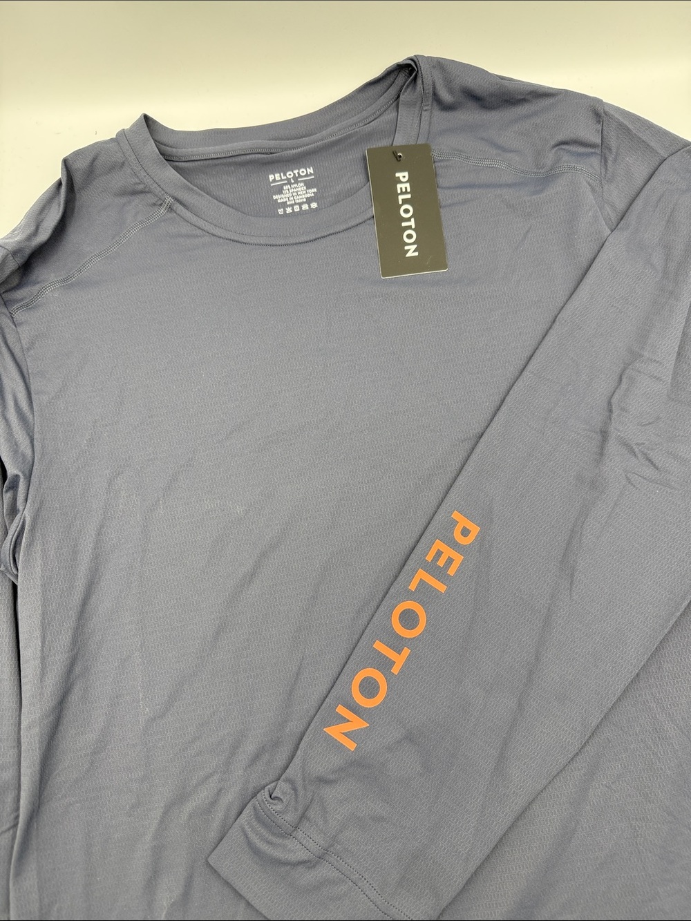 Peloton Men’s Long Sleeve Performance Tee - Navy with Orange Logo
